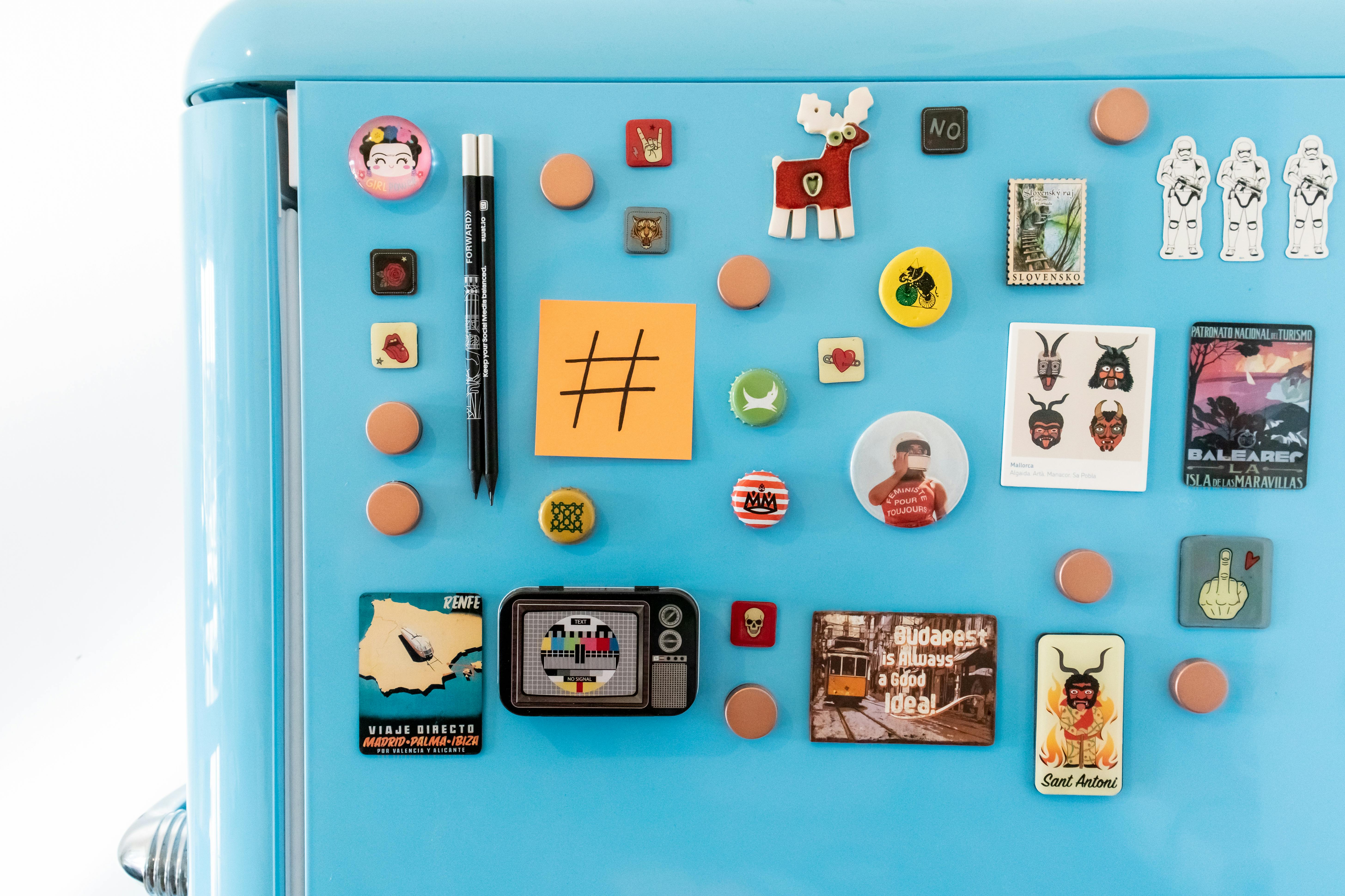 Photo magnets displayed together on a refrigerator
